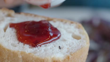 spreading jam on bread