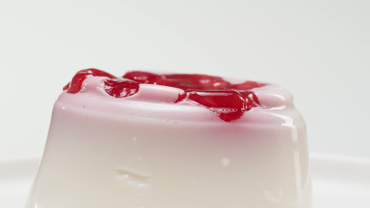Close-up of a panna cotta dessert with berry topping