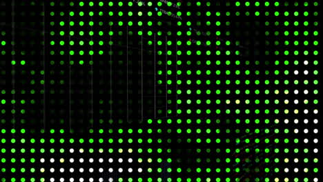 animation of green spots over data processing on black background