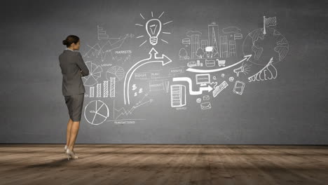 businesswoman looking at grey wall with brainstorm