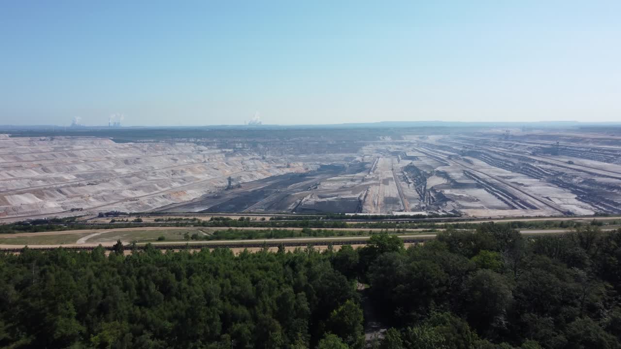 Hambach opencast lignite mine in the Rhenish lignite mining area in Germany, Aerial backwards
