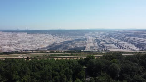hambach opencast lignite mine in the rhenish lignite mining area in germany, aerial backwards