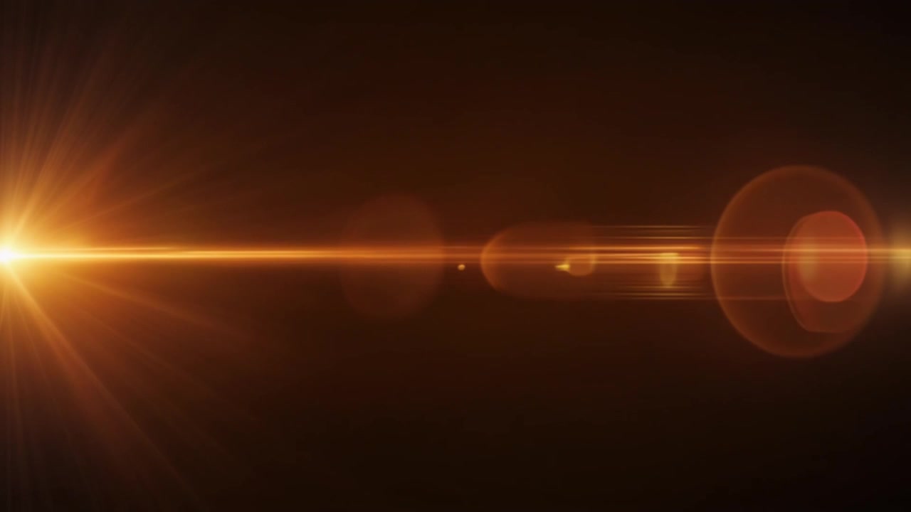 Effetto flare anamorfico dorato su sfondo scuro
