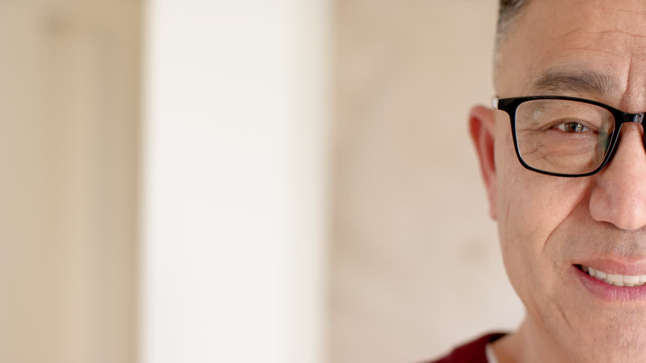 Christmas time, Smiling senior man wearing glasses enjoying festive holiday at home, copy space