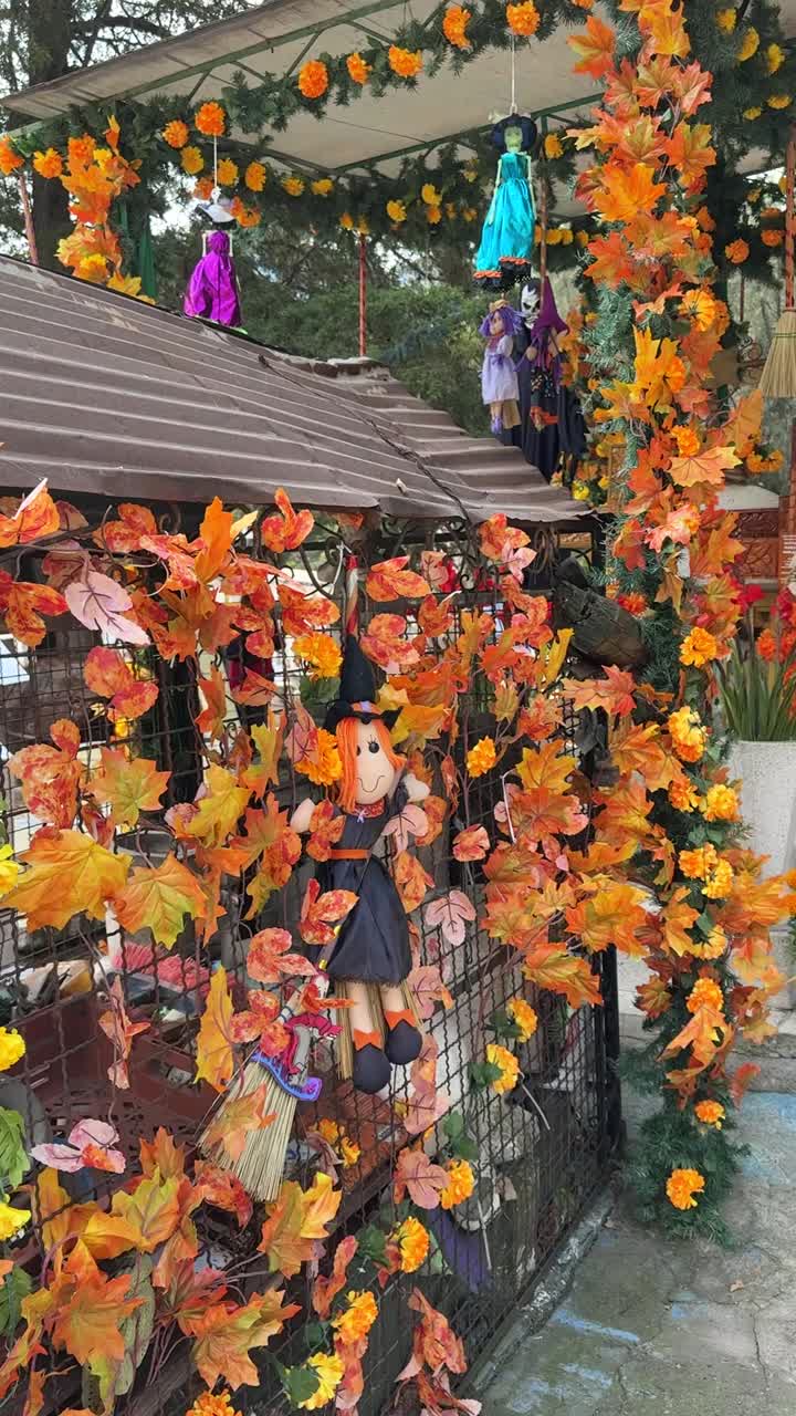 Mexican cemetery transformed with festive fall decorations for Día de Muertos