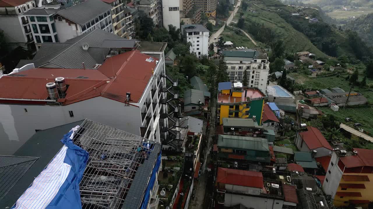 Tiltin aerial rooftop shot of a city in Vietnam