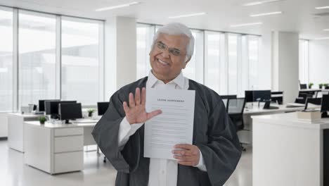 happy indian senior lawyer presenting his case in court