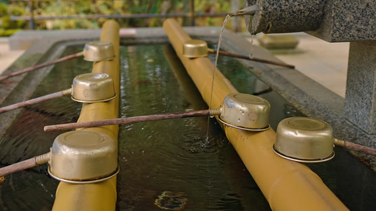 Cleansing fountain water flowing at Danjo Garan in Mount Koya, Koyasan, Japan.