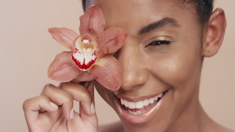 close up beauty portrait beautiful african american woman playfully touching body with orchid flower caressing healthy skin complexion enjoying gentle fragrance of natural essence skincare concept