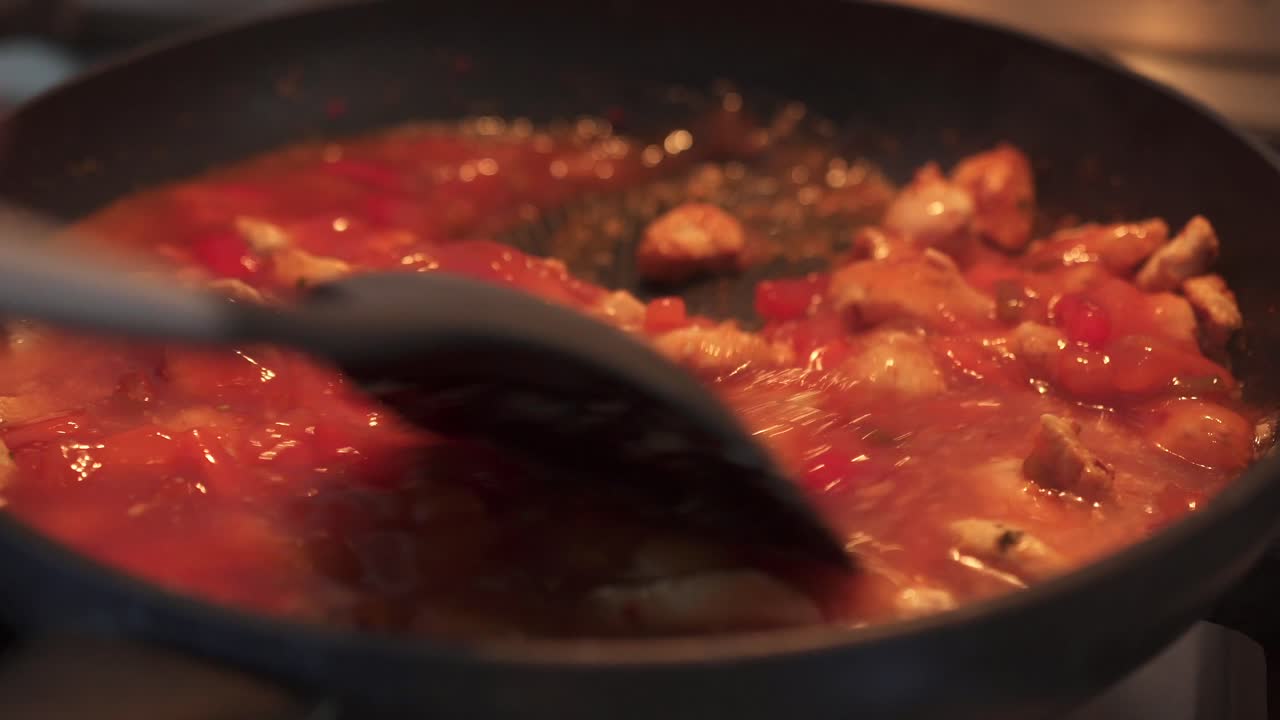 Sweet and Sour Sauce Being Stirred in Saucepan In Home Kitchen
