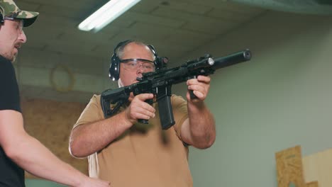 the stressed student fires the first shot from the rifle at the shooting range