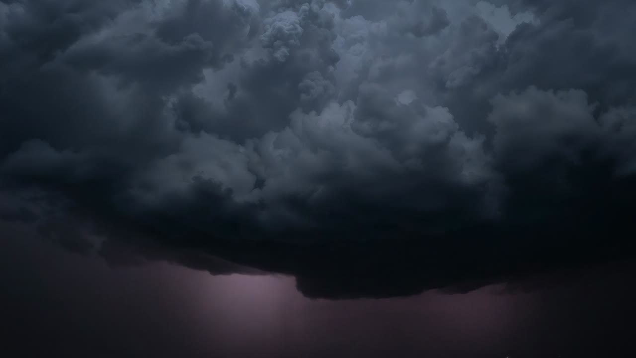 Building electrical charge in cumulonimbus cloud and discharging lightning bolts at night