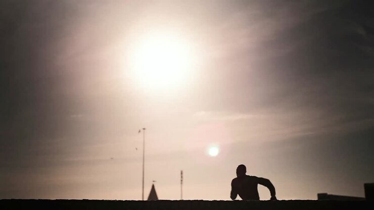 Man running and jumping on the beach