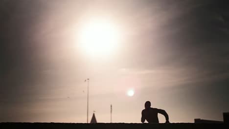 Man-running-and-jumping-on-the-beach