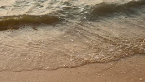 Ocean-Waves-Crash-on-the-Sandy-Beach-in-Pattaya,-Thailand