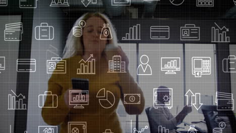 using smartphone with financial data animation, businesswoman in modern office