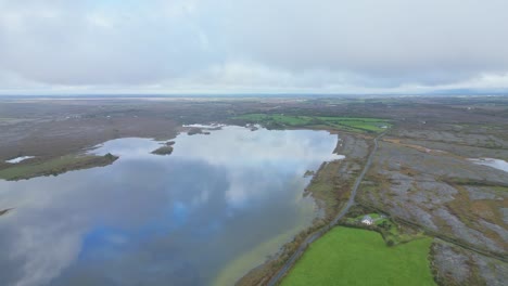 burren’s iconic karst limestone pavement, showcasing rugged geology and unique irish landscape under cloudy skies, aerial view