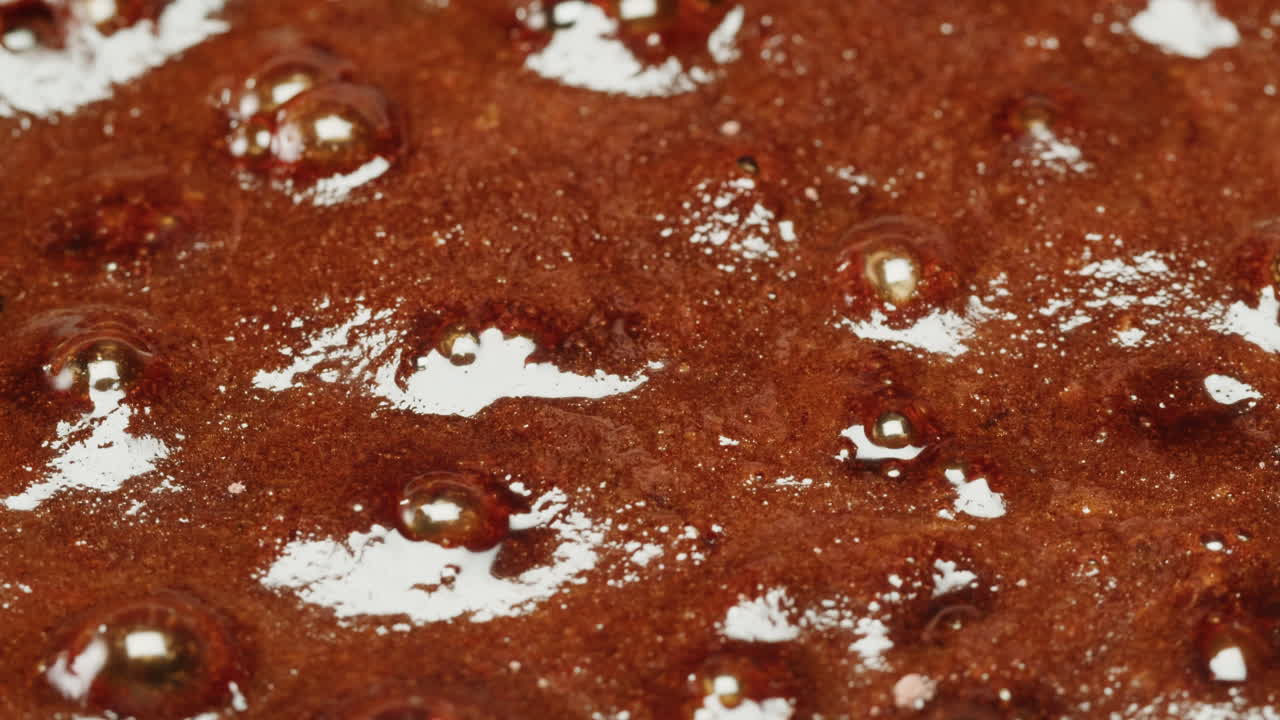 Close-up of a bubbling caramel or candy mixture
