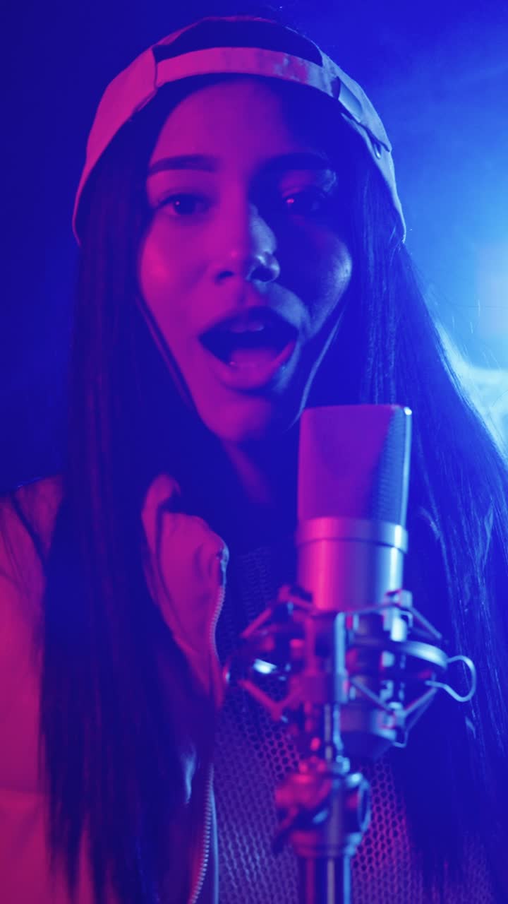 Woman singing into a microphone
