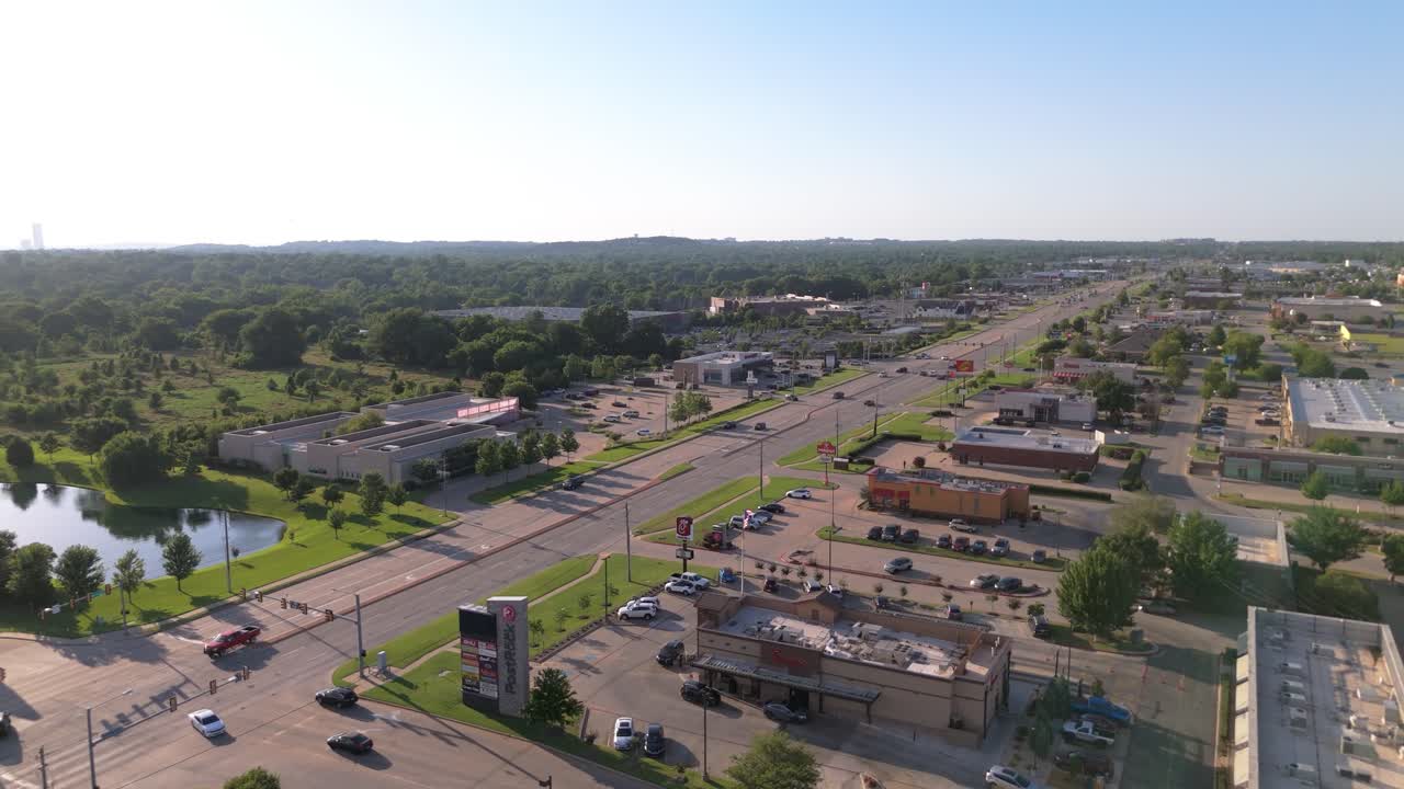 Drone view over South Tulsa’s South Memorial Drive—lined with shops, restaurants, and a splash of green, where weekday hustle meets laid-back Oklahoma charm