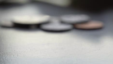 spinning coin on a dark surface