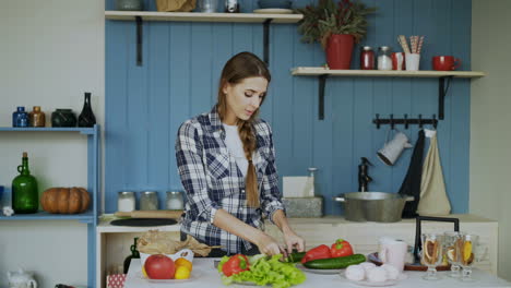 woman cooking a salad in a kitchen