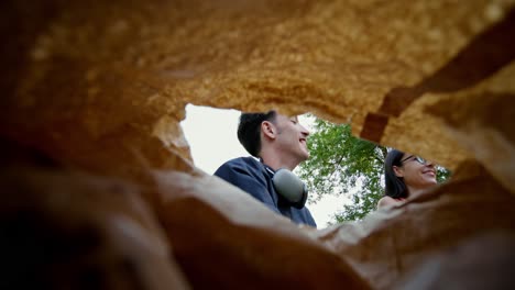 couple enjoying a picnic under a paper bag