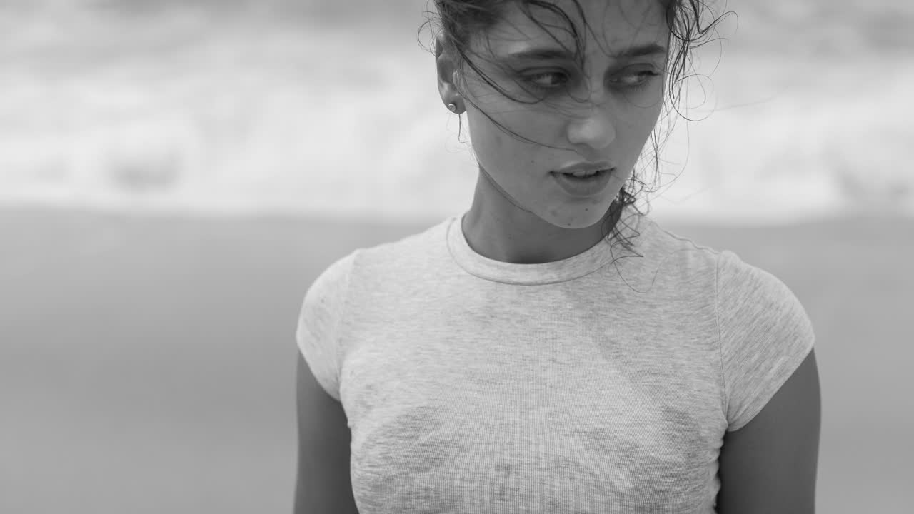 Black and white portraits of a woman on the beach