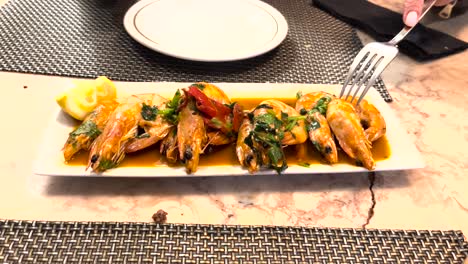 serving dish showcases succulent shrimp, perfectly sautéed with garlic, enticing the taste buds with its irresistible aroma and flavour