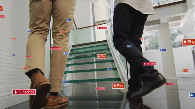 Two execs walking glass stairs, stepping onto treads and causing floating icons en route to meeting