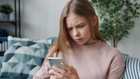 Teenage Girl Looking at Smartphone