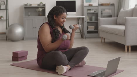 african woman training at home