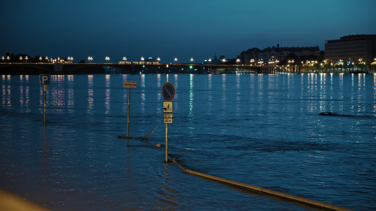 Nighttime Flood in City with River and Bridge