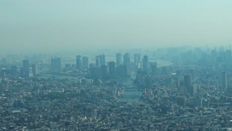 zoom out, aerial view of tokyo with skylines from skytree tower