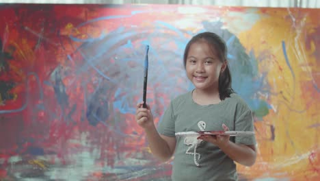 girl painting in art studio