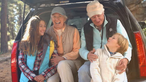 grandparents and grandkids at the back of car before hiking