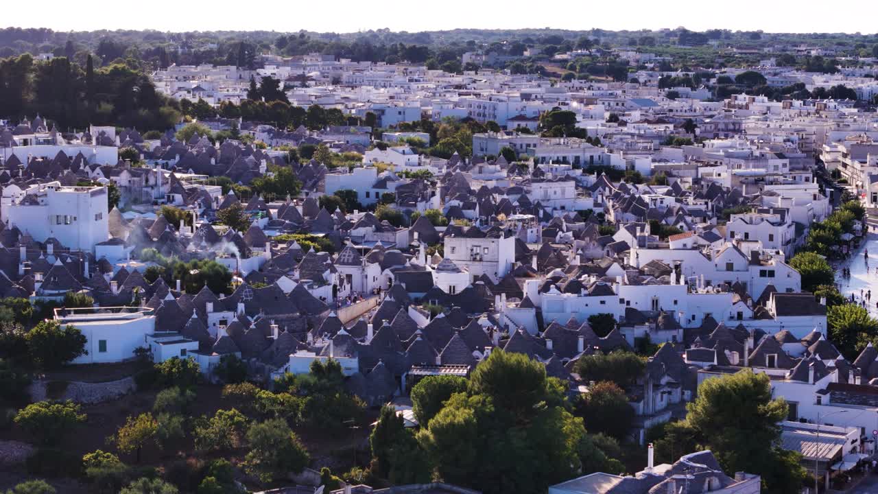Trulli home township of Arbelobello, aerial drone orbit view