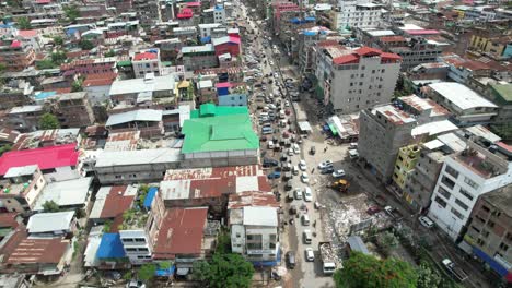 aerial drone shot of buildings, cars, people, bridges, and more in india