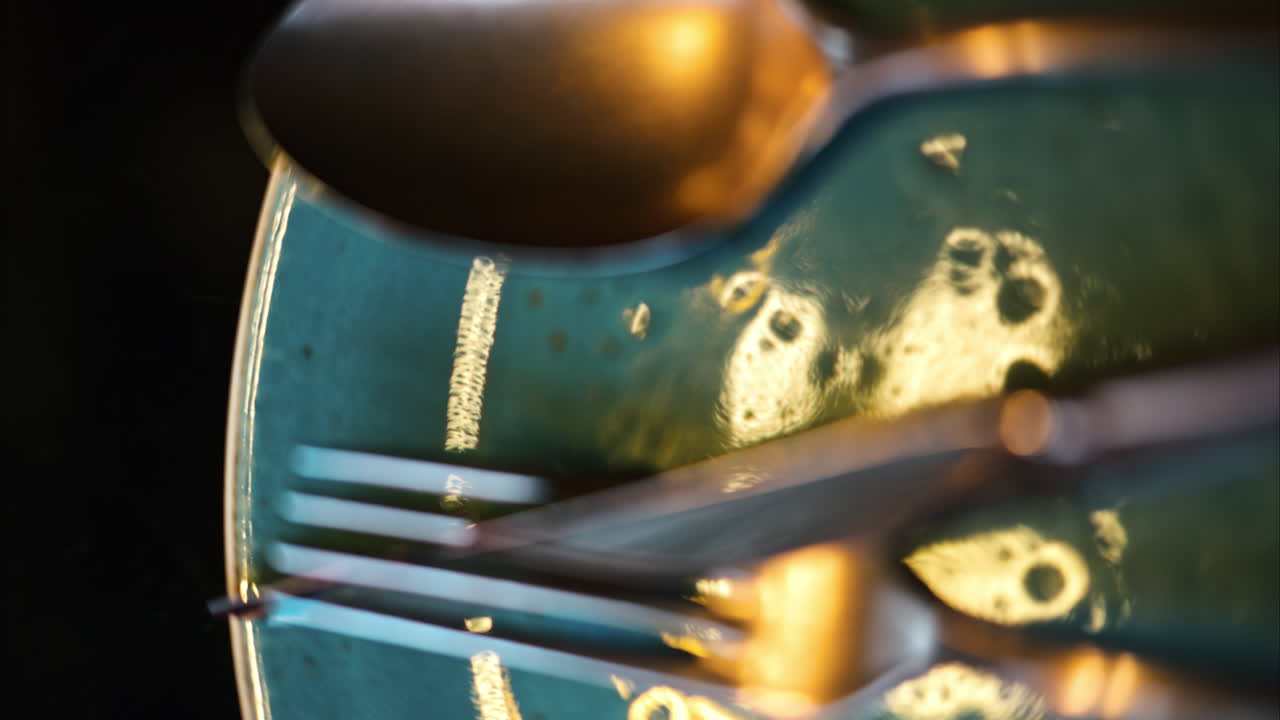Stainless steel food cutlery on a ceramic plate
