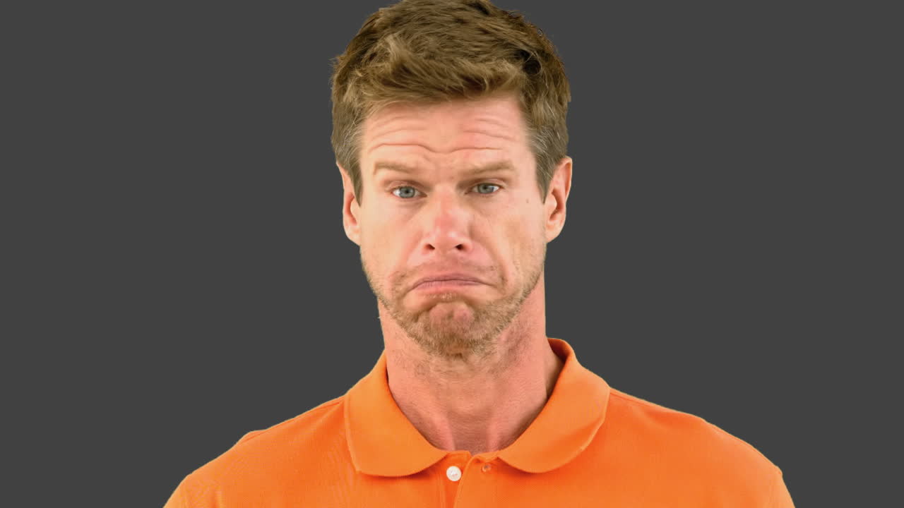 Man saying no with his head on grey screen