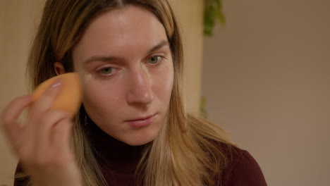 Girl-doing-makeup-on-herself-at-home