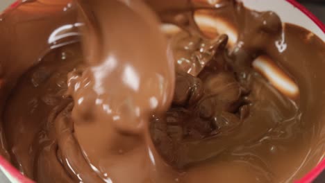 mixing melted chocolate with chocolate chips