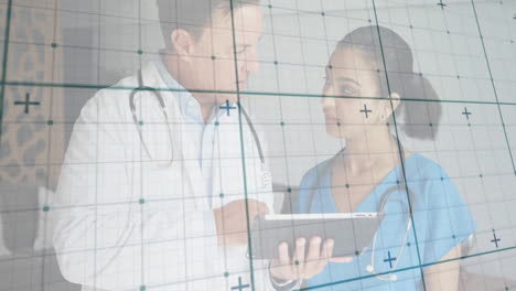 Male doctor pointing tablet while female nurse following health tech grid visualization