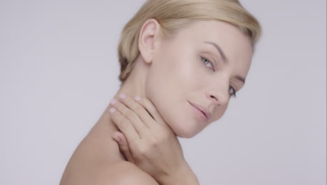 beautiful healthy woman touching smooth skin on face in slow motion for beauty skincare concept on a grey background red epic dragon