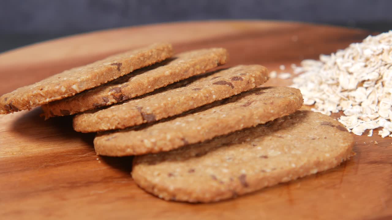Stack of chocolate cookies on wooden background