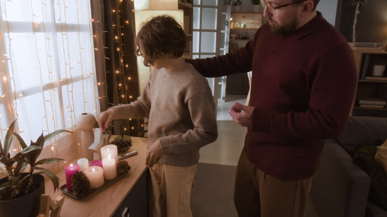 Family decorating with candles