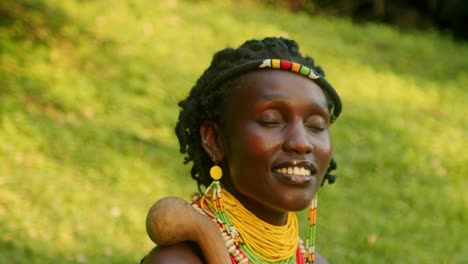 radiant smile of a woman from the karamojong tribe in uganda, east africa - close up