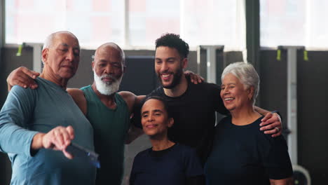 group of friends taking a selfie at the gym