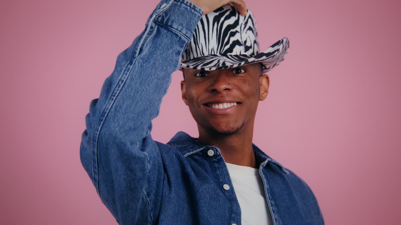 Man wearing a zebra print cowboy hat