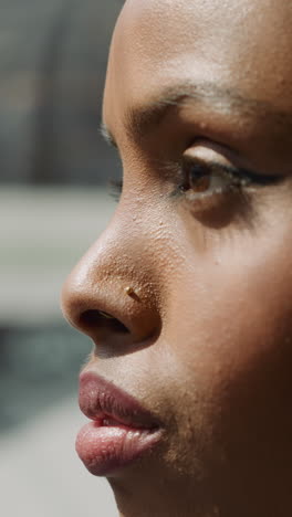 young african-american lady with hijab looks around standing in shopping mall elevator closeup slow motion. muslim woman with plump lips in business center